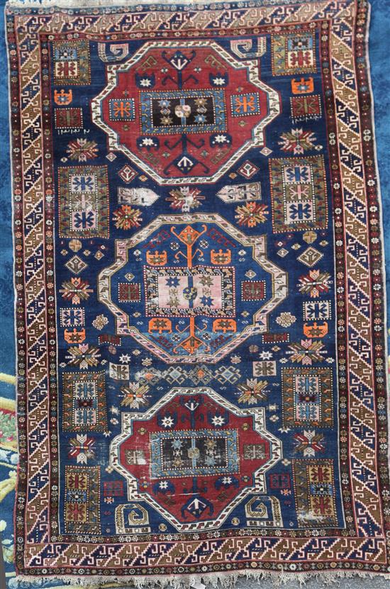 A Shirvan blue ground rug, 9ft 3in by 6ft 4in.